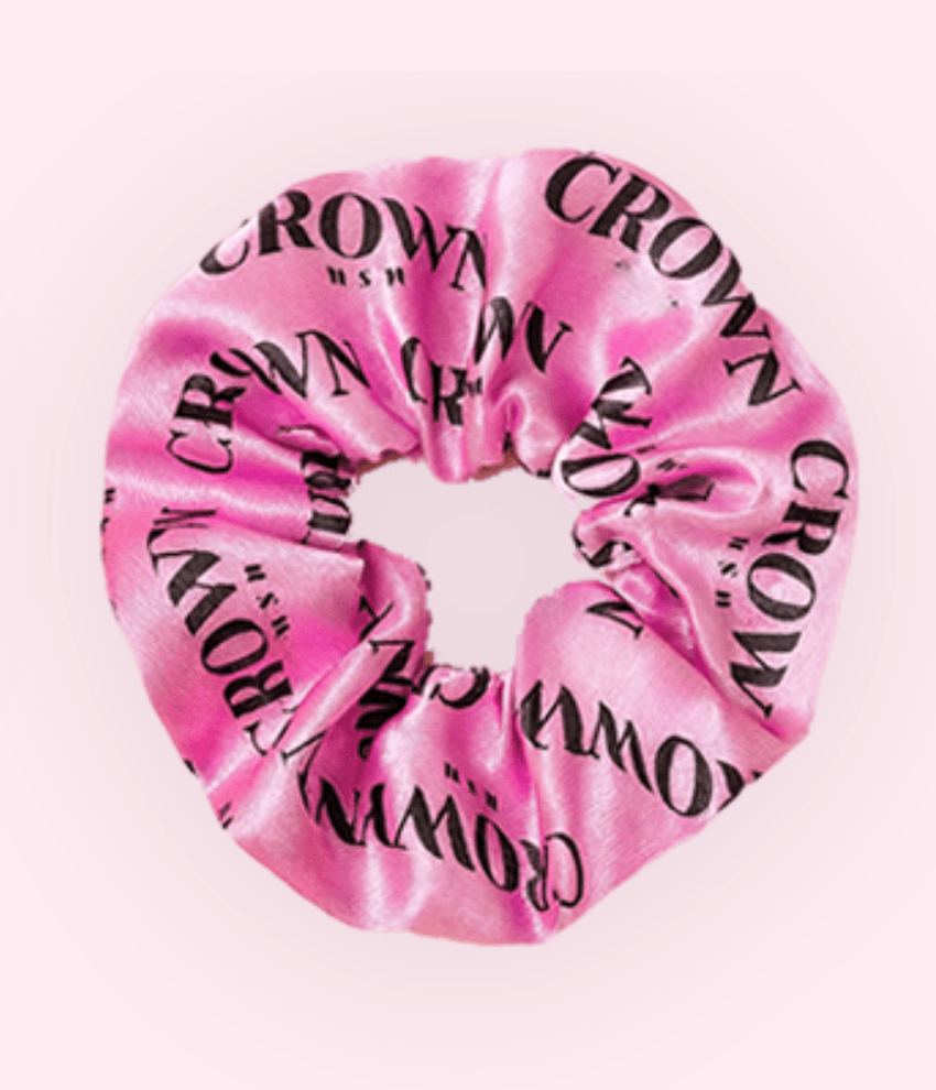 Satin Scrunchie in soft pink satin featuring CROWN WASH logo, perfect for frizz-free styling and a luxurious finish.