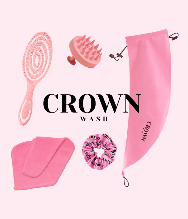 The Ultimate Crown Wash Kit featuring pink wash accessories, including a scalp massager, pony cap, and scrunchie.